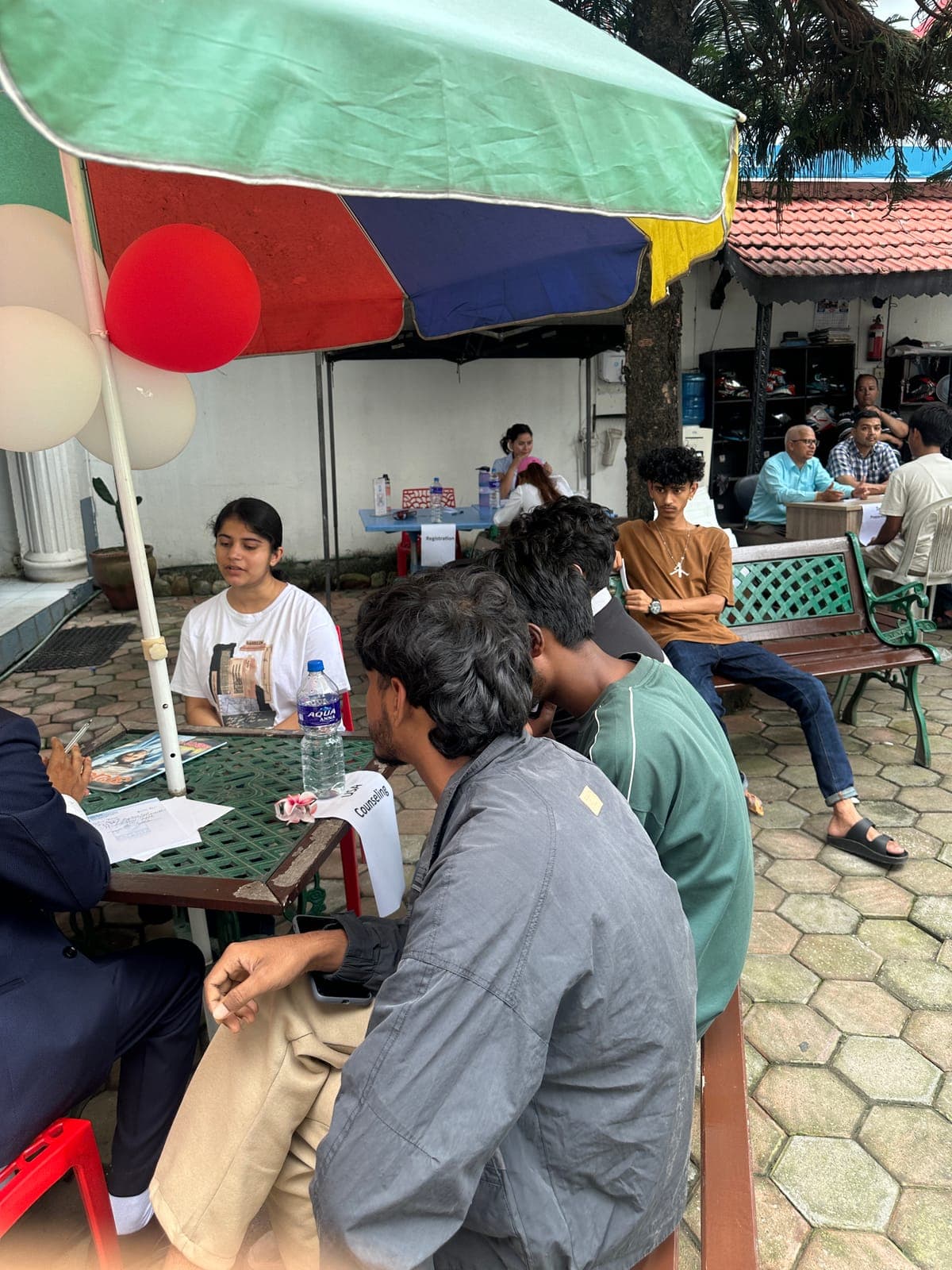 Students talking with Orbit staff in the office courtyard
